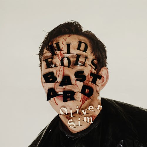 Image shows the cover design by Vasiliis Marmatakis for Oliver Sim album Hideous Bastard, which shows the album title letters inserted into a bloody portrait